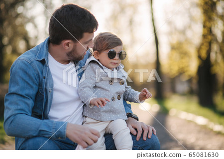 denis meagher add daughter sits on dads lap photo