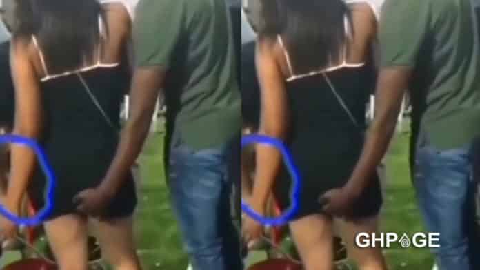 man fingering woman in public