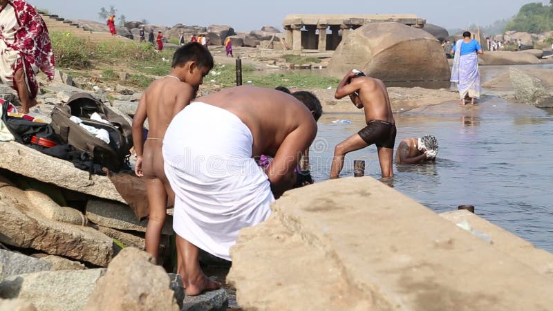 naked indian bathing